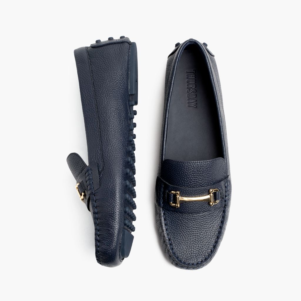 https://cdn.shopify.com/s/files/1/0419/1525/files/1024x1024-Women-DrivingLoafer-NavyGold-062524-Flatlay1.jpg?v=1757957649