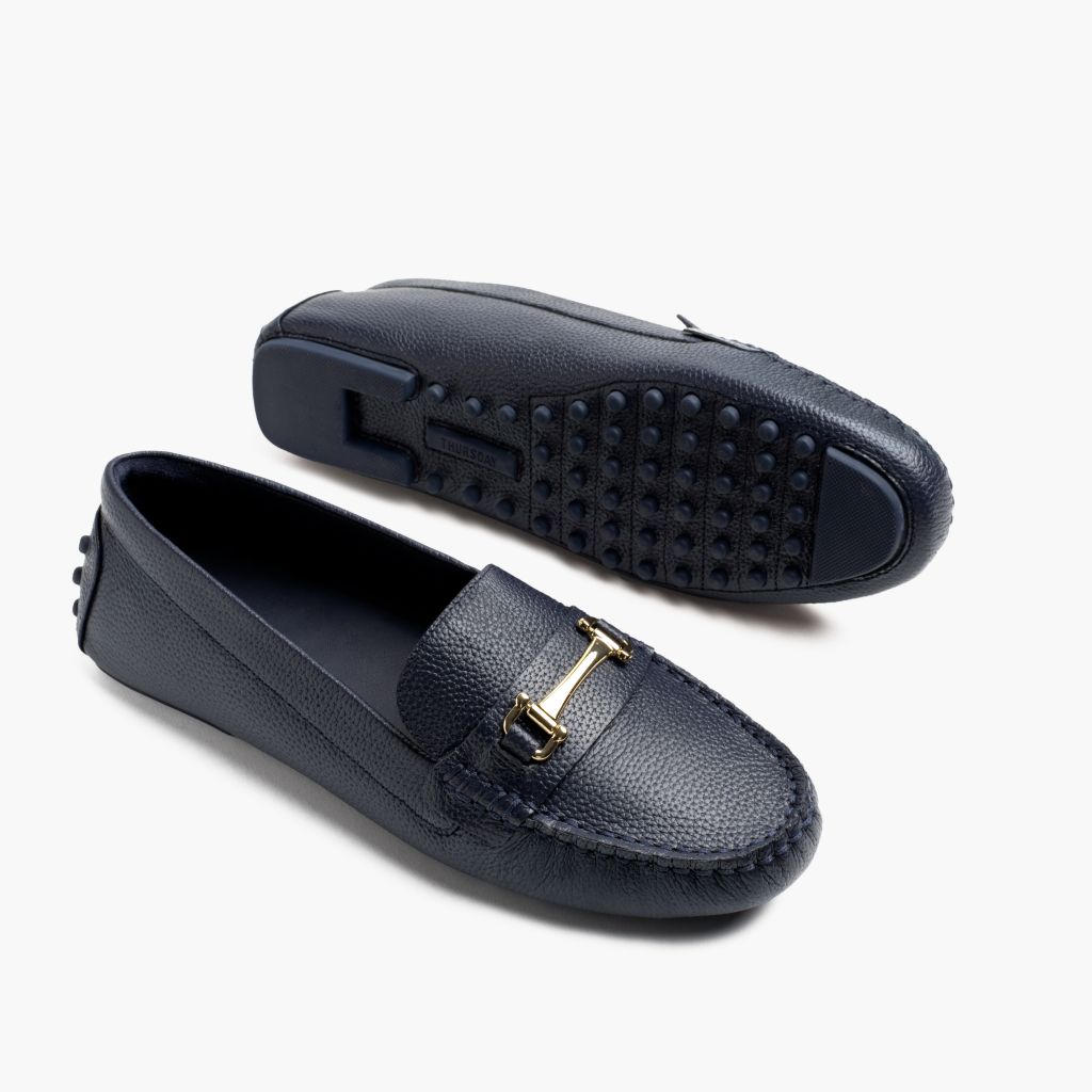 https://cdn.shopify.com/s/files/1/0419/1525/files/1024x1024-Women-DrivingLoafer-NavyGold-062524-FlatlayAlt.jpg?v=1757957649