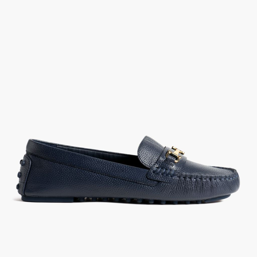 https://cdn.shopify.com/s/files/1/0419/1525/files/1024x1024-Women-DrivingLoafer-NavyGold-062524-Side.jpg?v=1757957649