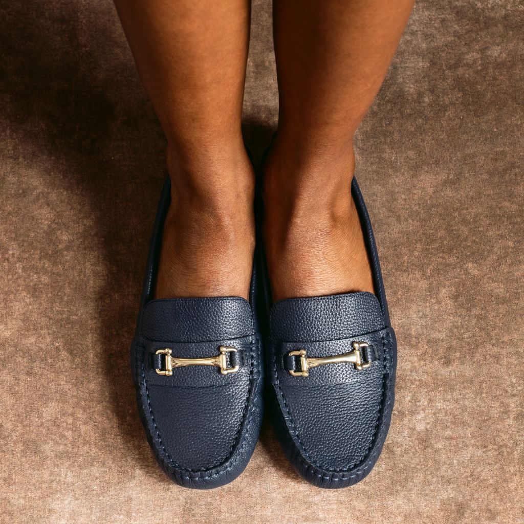 https://cdn.shopify.com/s/files/1/0419/1525/files/1024x1024-Women-DrivingLoafer-NavyGold-082025-1.jpg?v=1757956422