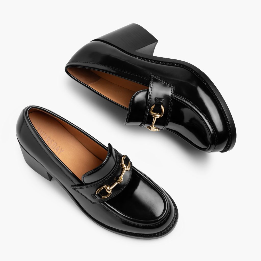 https://cdn.shopify.com/s/files/1/0419/1525/files/1024x1024-Women-HighHeelPenny-BlackxGold-012925-FlatlayAlt.jpg?v=1739893277