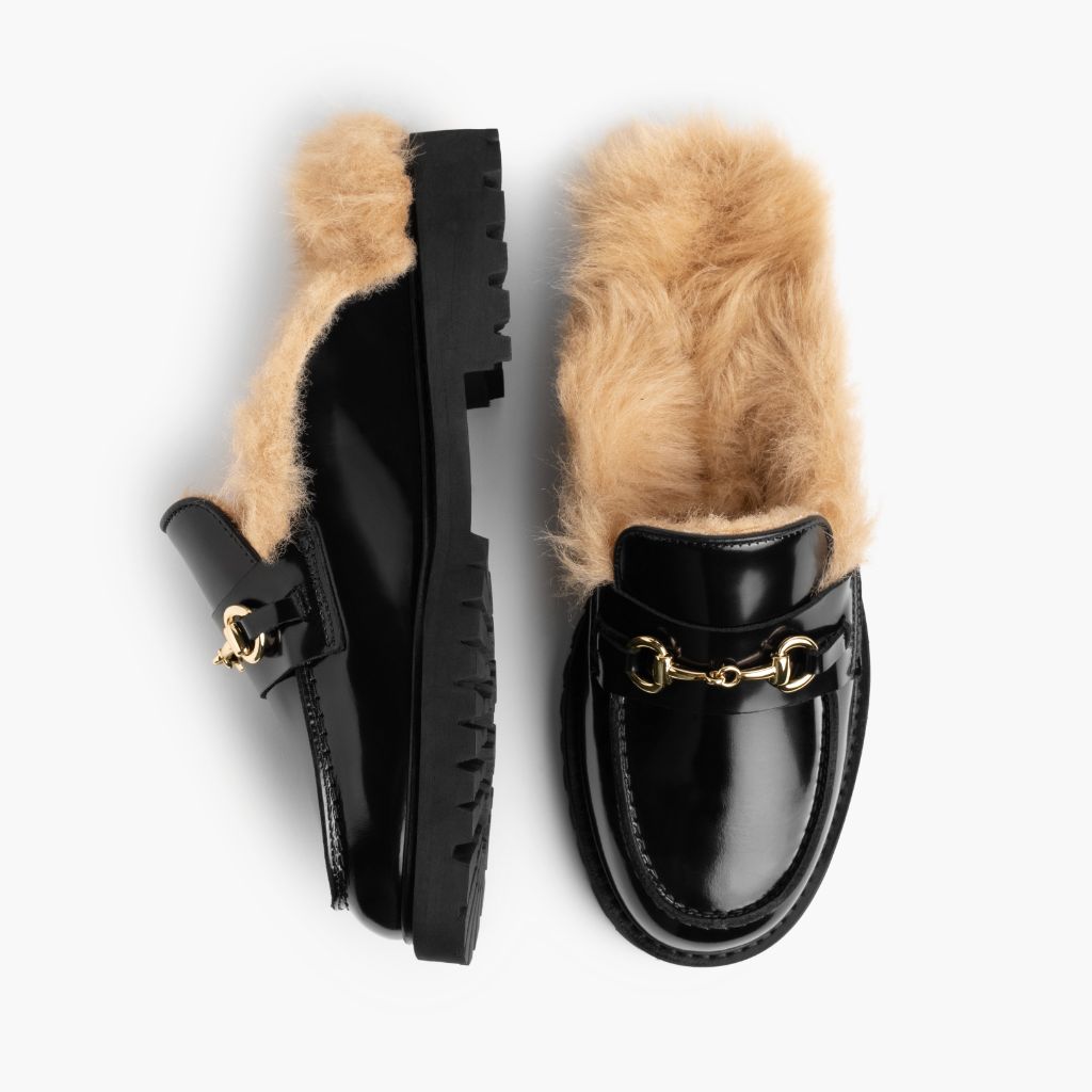 https://cdn.shopify.com/s/files/1/0419/1525/files/1024x1024-Women-PennyMule-BlackBeigeShearling-070825-Flatlay1.jpg?v=1757443895