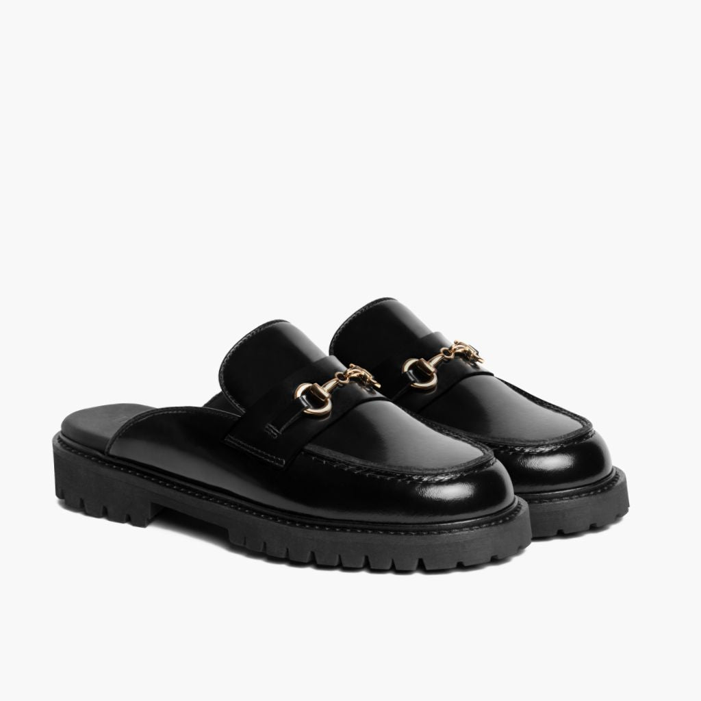 https://cdn.shopify.com/s/files/1/0419/1525/files/1024x1024-Women-PennyMule-BlackGold-102324-3.4_89567950-b8e9-4fea-8599-3b340102d9fb.jpg?v=1730318444