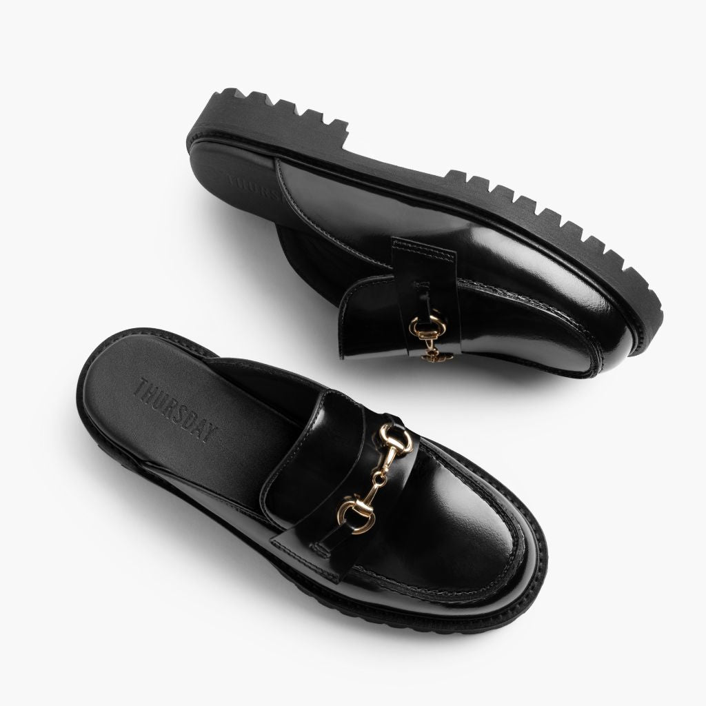 https://cdn.shopify.com/s/files/1/0419/1525/files/1024x1024-Women-PennyMule-BlackGold-102324-FlatlayAlt_d931a0d3-de1e-47b5-850e-57dae33d8e4d.jpg?v=1730318444