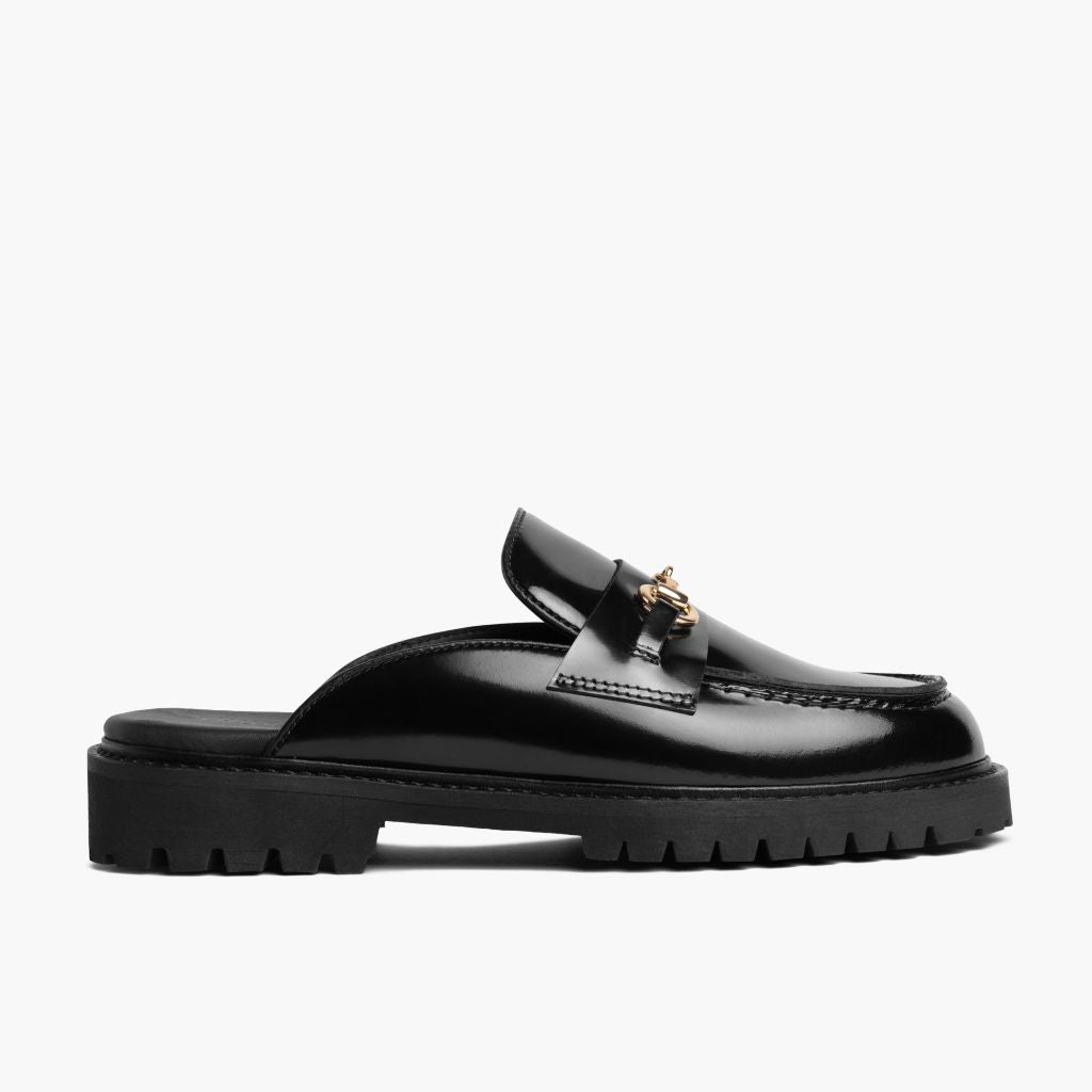https://cdn.shopify.com/s/files/1/0419/1525/files/1024x1024-Women-PennyMule-BlackGold-102324-Side_77f4ba04-e5a4-4c11-a93d-d0cb0d7cbf97.jpg?v=1730318444