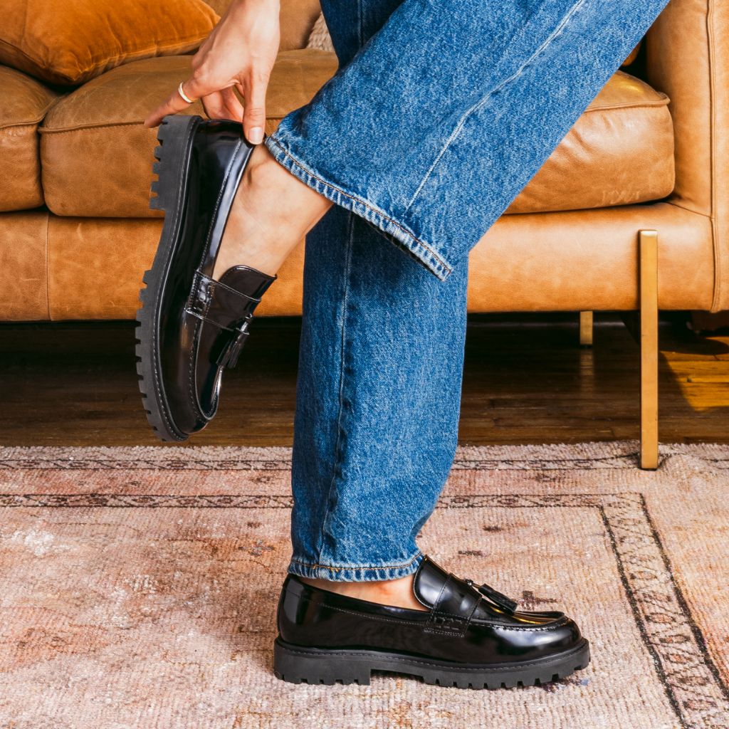 https://cdn.shopify.com/s/files/1/0419/1525/files/1024x1024-Women-TasselPenny-Black-012226-1.jpg?v=1771868212