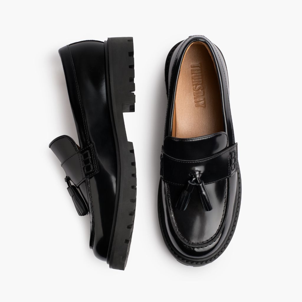 https://cdn.shopify.com/s/files/1/0419/1525/files/1024x1024-Women-TasselPenny-Black-012226-Flatlay1.jpg?v=1771868250