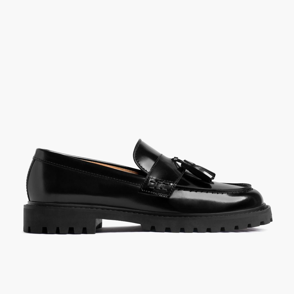 https://cdn.shopify.com/s/files/1/0419/1525/files/1024x1024-Women-TasselPenny-Black-012226-Side.jpg?v=1771868250
