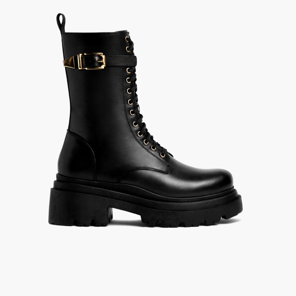 https://cdn.shopify.com/s/files/1/0419/1525/files/1024x1024-Womens-Fatale-BlackGold-100623-Side.jpg?v=1696883251