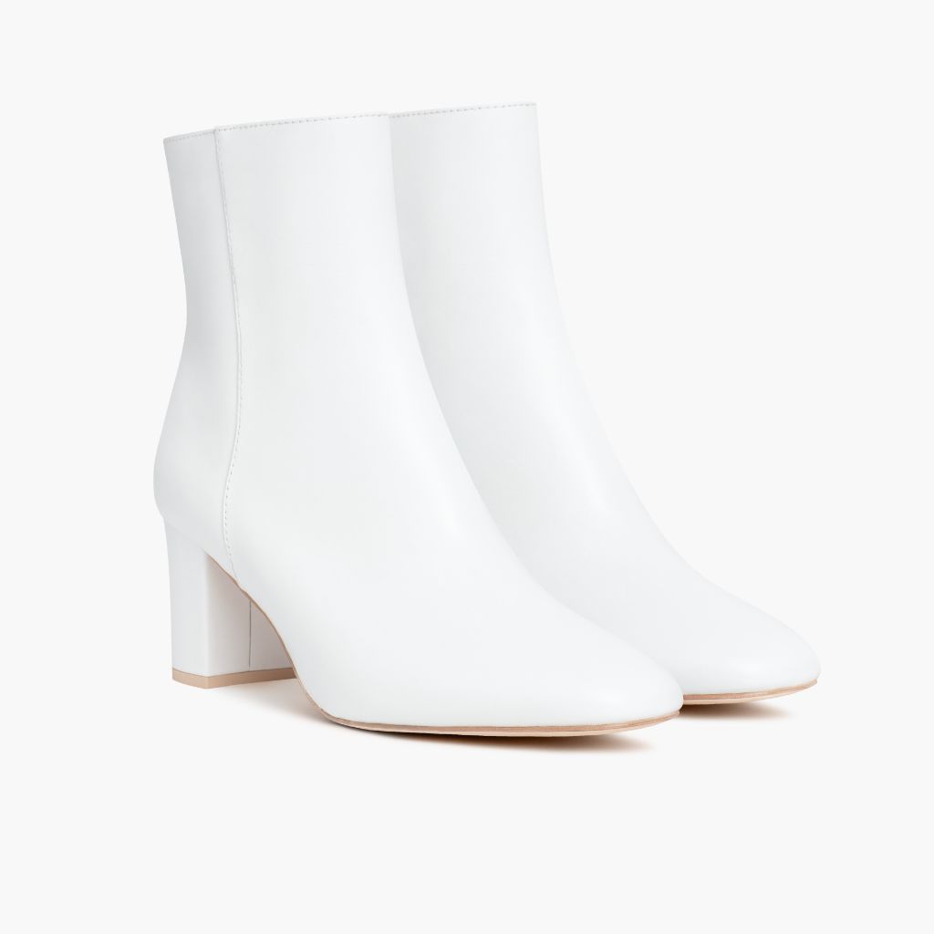 https://cdn.shopify.com/s/files/1/0419/1525/files/1024x1024-Womens-HighStandard-White-102423-3.4.jpg?v=1698686558