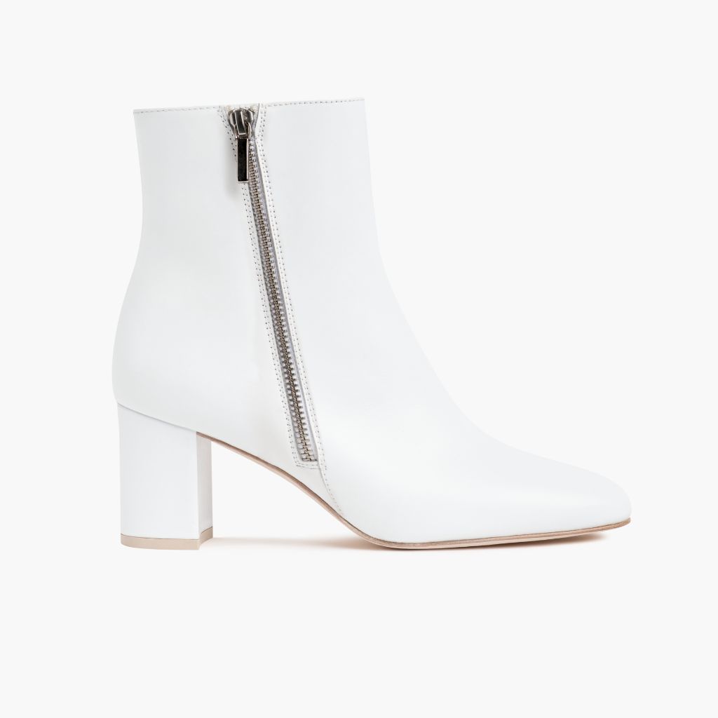 https://cdn.shopify.com/s/files/1/0419/1525/files/1024x1024-Womens-HighStandard-White-102423-SideZip.jpg?v=1698686558