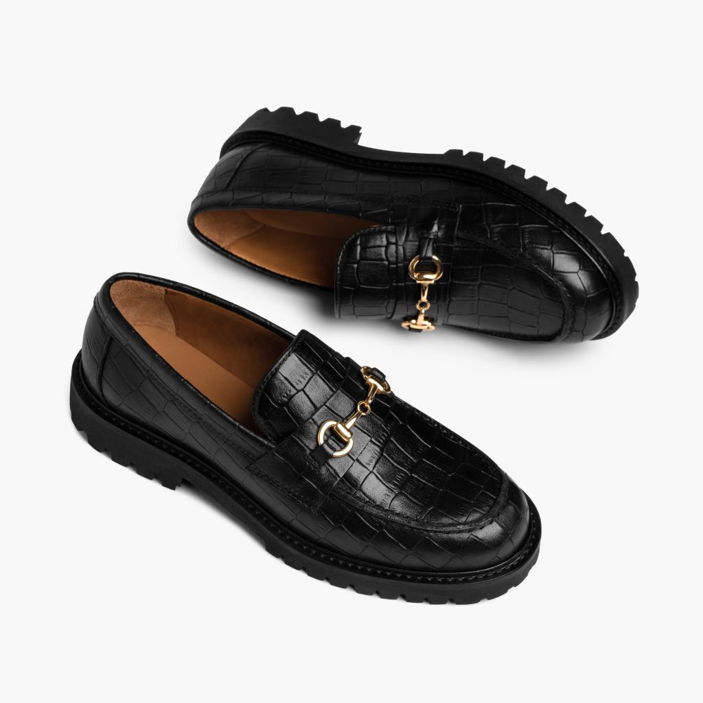 https://cdn.shopify.com/s/files/1/0419/1525/files/1024x1024-Womens-Penny-BlackCrocoGold-051324-FlatlayAlt.jpg?v=1718804392