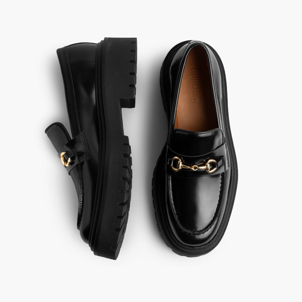 https://cdn.shopify.com/s/files/1/0419/1525/files/1024x1024-Womens-PennyPlatform-BlackGold-051324-Flatlay1.jpg?v=1718804613