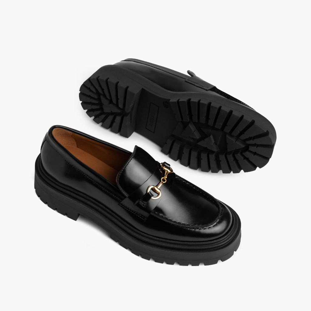 https://cdn.shopify.com/s/files/1/0419/1525/files/1024x1024-Womens-PennyPlatform-BlackGold-051324-FlatlayAlt.jpg?v=1718804613