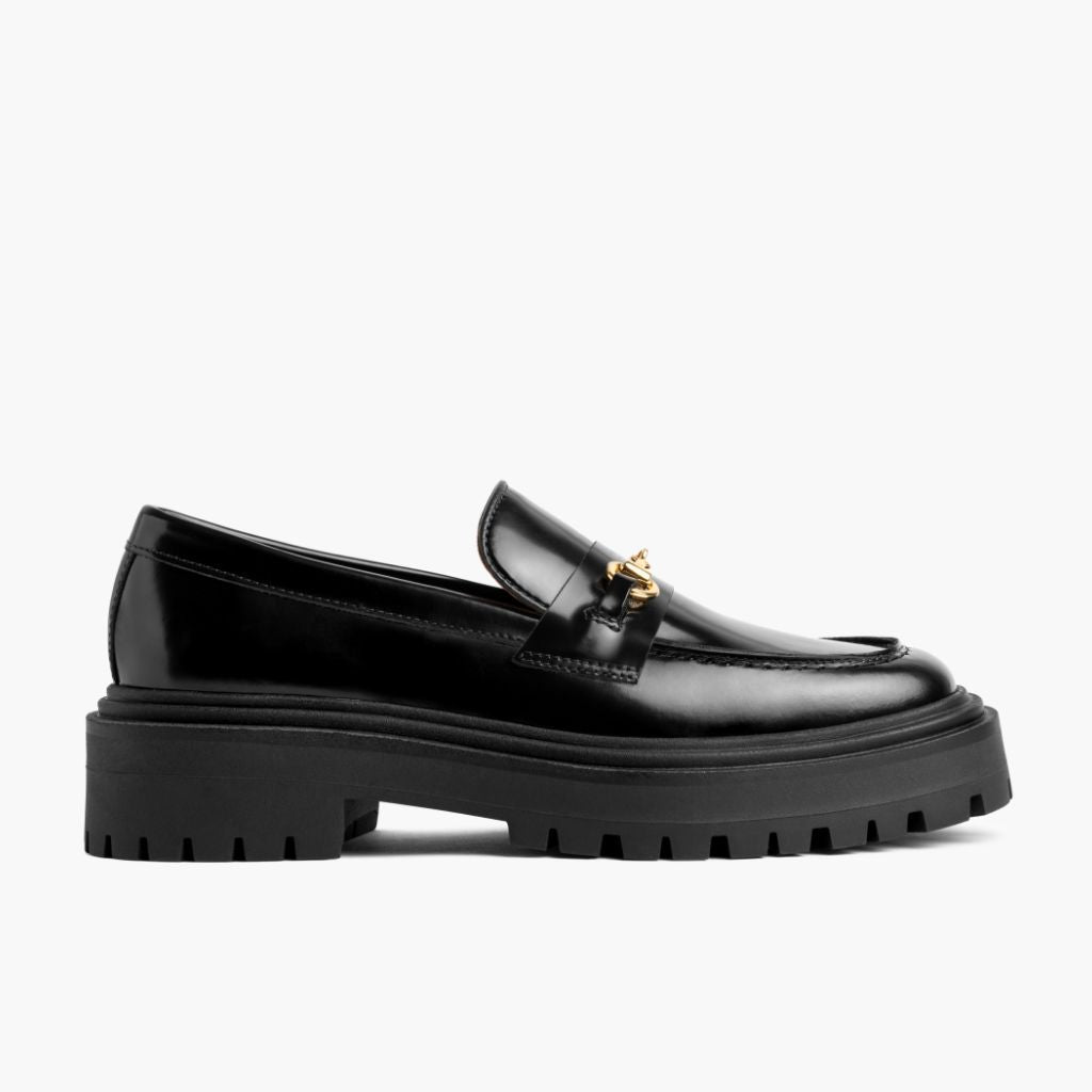 https://cdn.shopify.com/s/files/1/0419/1525/files/1024x1024-Womens-PennyPlatform-BlackGold-051324-Side.jpg?v=1718804613